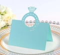 Detail of light blue laser-cut place card with diamond ring design on white porcelain plate - Light Blue