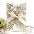 Elegant ivory laser cut wedding invitation with gold glitter and cream silk ribbon - Cyan Gold