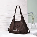 Close-up of brown large capacity tote bag with white logo and side zipper details - Dark Brown