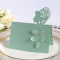 Laser-cut place card in light green featuring a girl silhouette with floral cutout - Sea Blue
