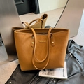 Brown leather tote bag for women with large capacity and metallic brand plate detail - Brown