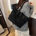 Minimalist black matte suede tote bag with gold logo plate and reinforced handles - Black