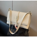 Detail of creamy beige pebble leather shoulder bag with elegant gold hardware buckles - Off-white