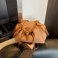 Brown woven texture mini backpack with drawstring closure and gold hardware accents - Brown