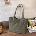 Olive green suede tote bag with golden logo and dual shoulder straps in a home setting - Green (No Pendant)