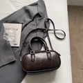 Vintage dark brown Boston bag with double handles and gold metal hardware accents - Coffee No Charm