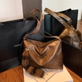 Deep brown retro leather shoulder bag with a minimalist design and fur tail charm - With Charm / Brown