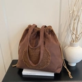 Brown suede tote bag with round fleece patch and drawstring detail for winter - Brown