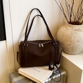 Large dark brown leather boston bag with detachable strap and silver lock charm - Brown
