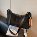 Black suede and leather shoulder bag with vintage wood bead charm and leopard print detail - Black with Pendant