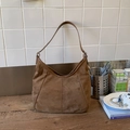 Brown matte suede bucket bag with a retro hobo design and vertical decorative stitching - Brown