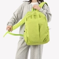 Light green and white checkered backpack with adjustable straps and drawstring pockets - Green