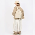 Minimalist cream white nylon backpack for women shown in a back-view style shot - Off White