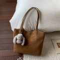 Close-up of brown suede tote bag featuring a cute grey bunny plush charm and brand logo - Brown with Pendant