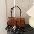 Retro dark brown glossy shoulder bag with vintage metal buckle and long straps - Brown