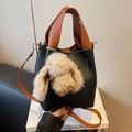 Two-tone bucket bag in black litchi pattern with brown straps and cute bunny pendant - With Pendant / Black