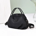 Minimalist black nylon hobo bag with adjustable strap and dual handles in variant black - Black