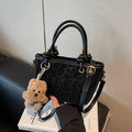 Chic black leopard print handbag with golden metal hardware and a plush bear charm - Black with Pendant