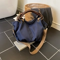 Large navy canvas tote bag with brown leather handles and khaki adjustable shoulder strap - Blue
