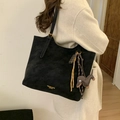 Large black suede tote bag with horse charm and golden buckle on model - Black with Pendant
