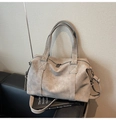 Macro detail of high-capacity matte tote bag with reinforced handles and long strap - Gray