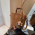 Brown vintage faux leather bucket bag with furry monster charm and adjustable strap - Brown with Pendant