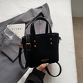 Fashionable black matte crossbody bucket bag with gold hardware on a grey blazer - Black without Pendant