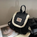 Mini sac à dos noir avec bordure en peau de mouton et écusson d'ours sur socle - Noir
