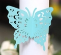 Dettaglio portatovagliolo a farfalla traforato al laser color blu Tiffany per banchetti - Blu Tiffany