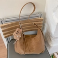 Brown vintage hobo bag with tassel detail and plush bear charm in a cozy setting - Brown with Pendant