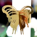 Golden butterfly napkin ring with hollow carved design for luxury wedding table decor - Reflective Gold