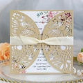 Detail showing laser-cut butterfly invitation with gold pearlescent shell and ribbon bow - Beige Gold