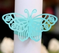 Detail of laser-cut butterfly napkin ring in mint green with elegant hollow patterns - Tiffany Blue