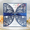Detail of laser-cut butterfly invitation in navy blue pearl paper with velvet ribbon - Magic Blue