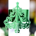 Metallic green laser-cut Christmas tree napkin ring with festive hollowed design - Reflective Green