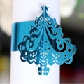 Laser-cut blue Christmas tree napkin ring with intricate hollow star pattern decoration - Reflective Blue
