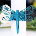 Metallic blue dragonfly napkin ring with intricate laser-cut heart patterns - Reflective Blue