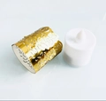 Close-up of golden hollow-out paper tea light wrap and white LED electronic candle - Reflective Gold