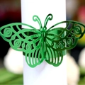 Elegant emerald green butterfly napkin ring with laser-cut hollow design for wedding decor - Reflective Green