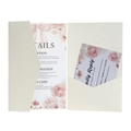 Detail view of laser-cut wedding invitation set with floral detail and RSVP card - Ivory