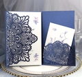 Detailed laser-cut navy blue wedding invitation with elegant lace pattern and floral insert - Magic Blue