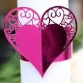 Pink heart-shaped hollow laser-cut napkin ring with elegant floral scroll patterns - Reflective Rose Red