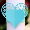 Elegant light blue laser-cut paper napkin ring with intricate heart scrollwork design - Tiffany Blue