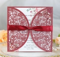 Detailed laser cut rose patterns on burgundy wedding invitation with red silk ribbon bow - Dark Red
