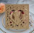 Detail of laser-cut heart silhouette and floral inlay on kraft paper wedding invitation - Kraft Paper