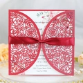 Laser cut red rose wedding invitation with a deep red satin bow and floral inner card - Pearlescent Red