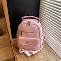 Fashionable light pink faux leather backpack with litchi texture and metal logo - Pink