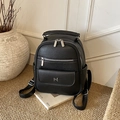 Chic black litchi grain leather backpack with silver hardware and multi-pocket design - Black