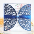 Navy blue laser-cut wedding invitation with elegant floral hollow patterns and a satin bow - Deep Blue