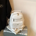 Chic off-white litchi grain small backpack featuring minimalist metal N-shaped logo design - White